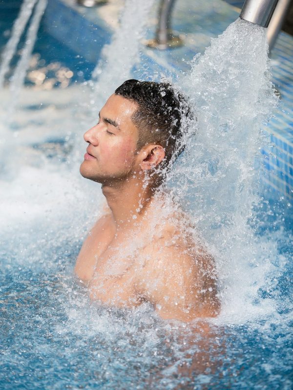 Handsome man in hydrotherapy pool